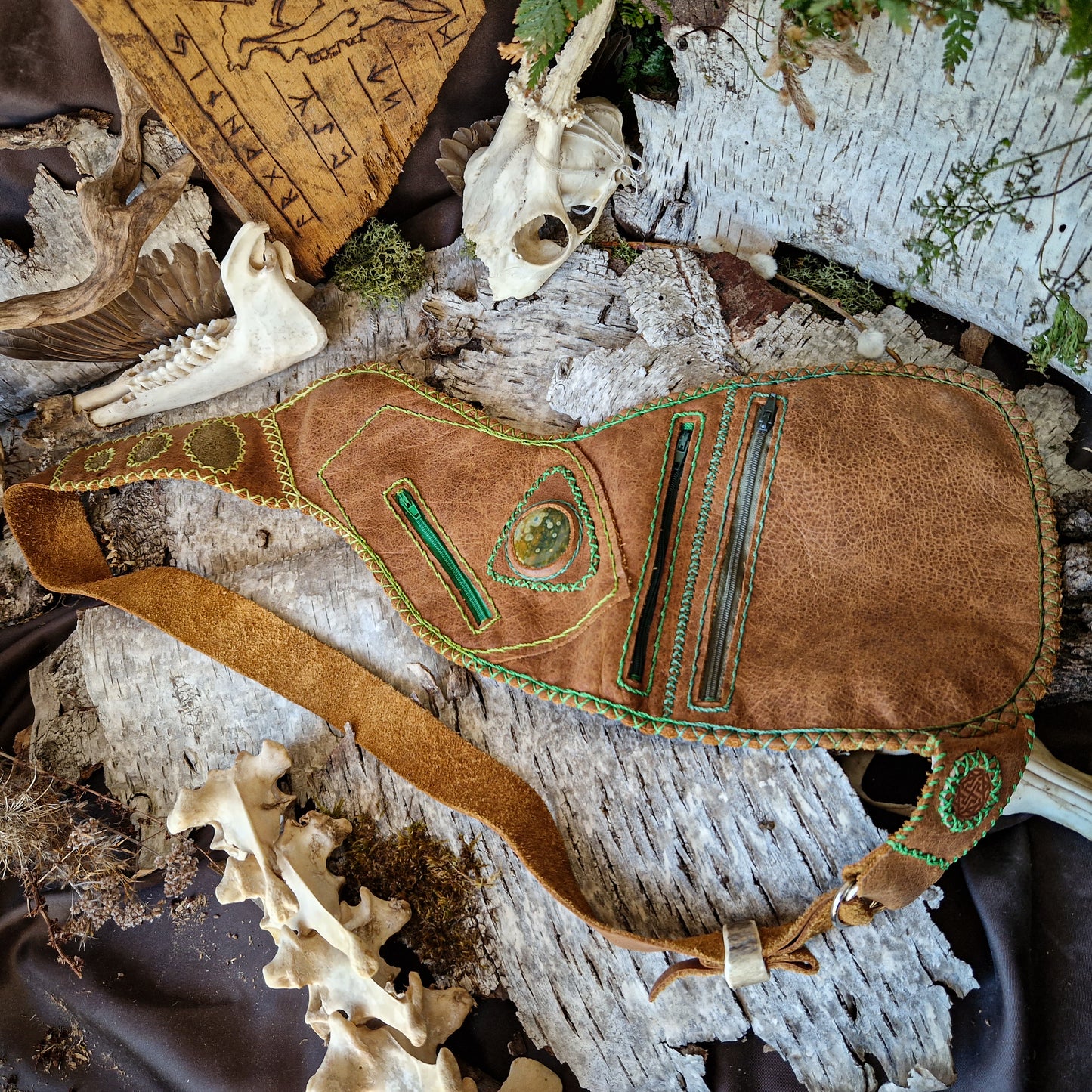 Brown leather bag with green string