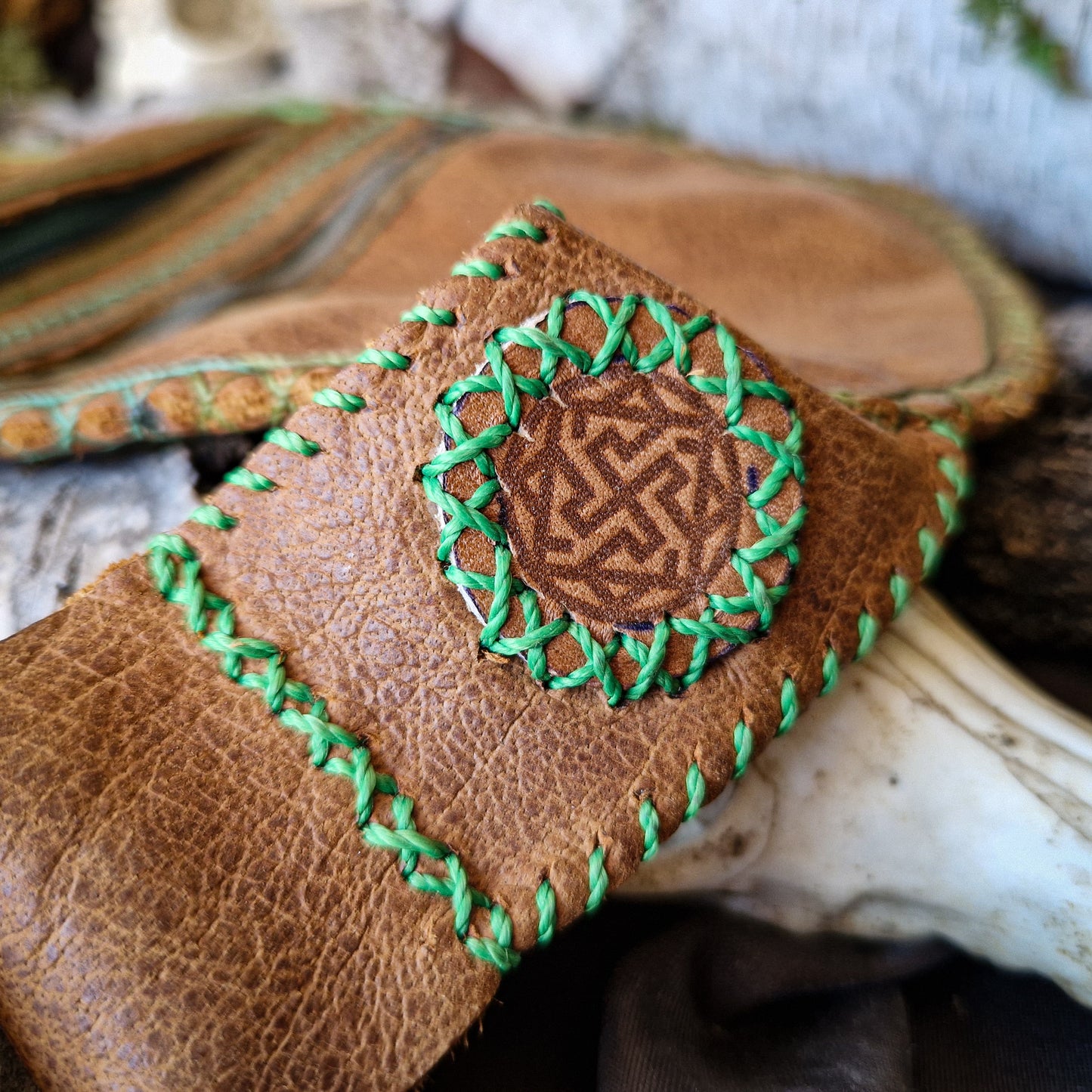 Brown leather bag with green string