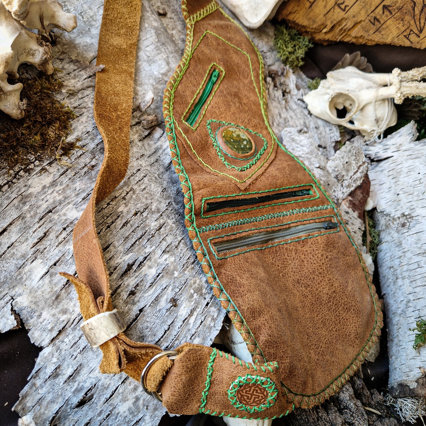 Brown leather bag with green string